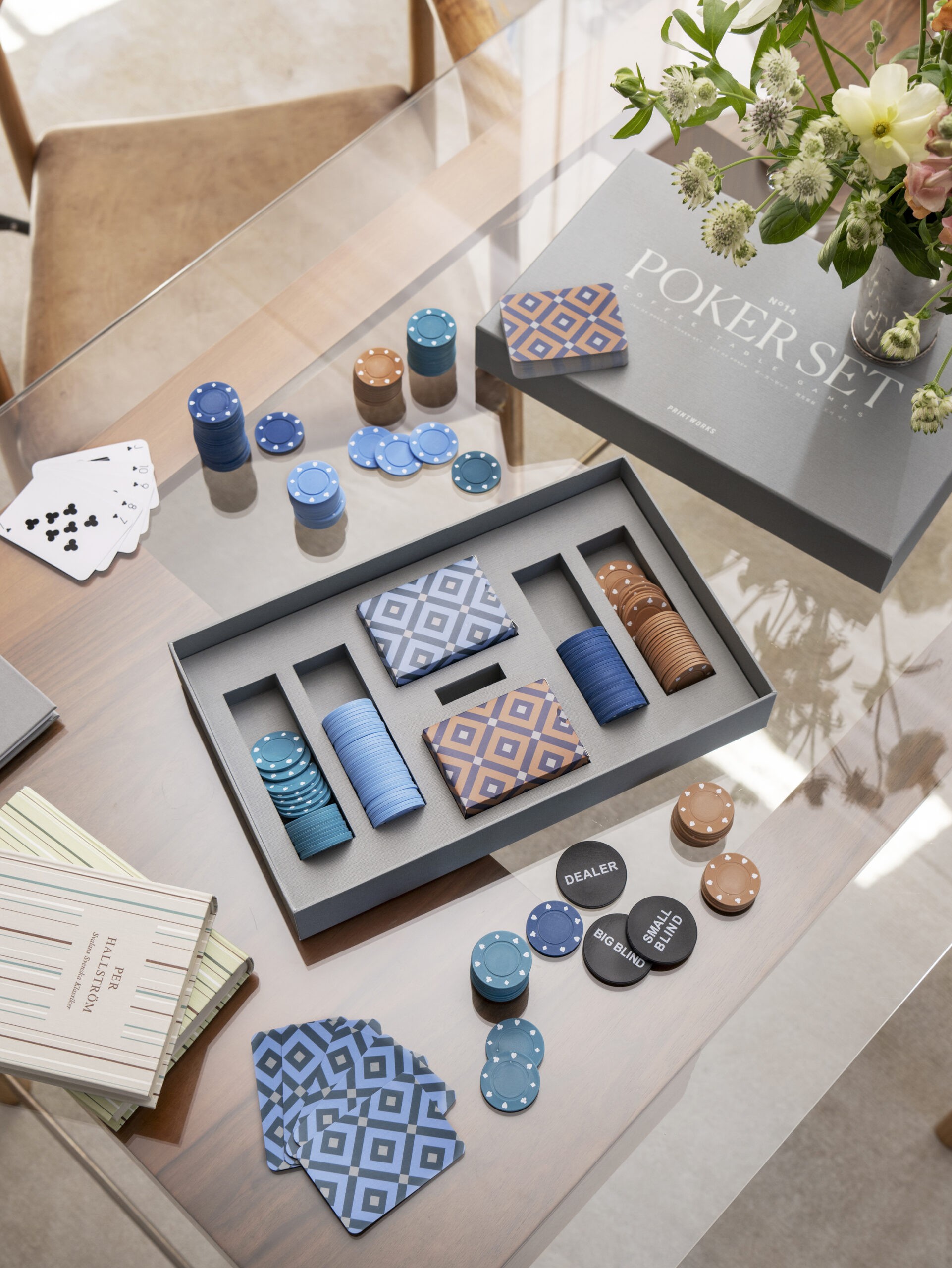 Luxury designer poker set in minimalist grey box with playing cards and chips