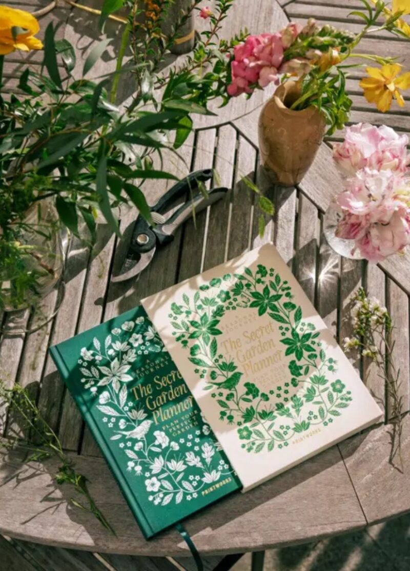The secret garden planner book from Printworks out of cover in green garden