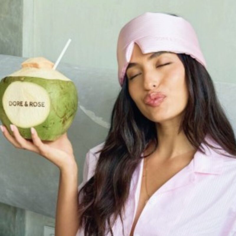 White and pink striped silk sleep mask by Dore & Rose on model