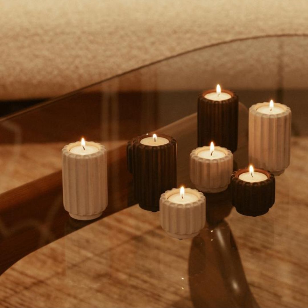 A warm candle holder in a mocha shade. The Dentelles tall design adds height and a cosy glow to any interior.