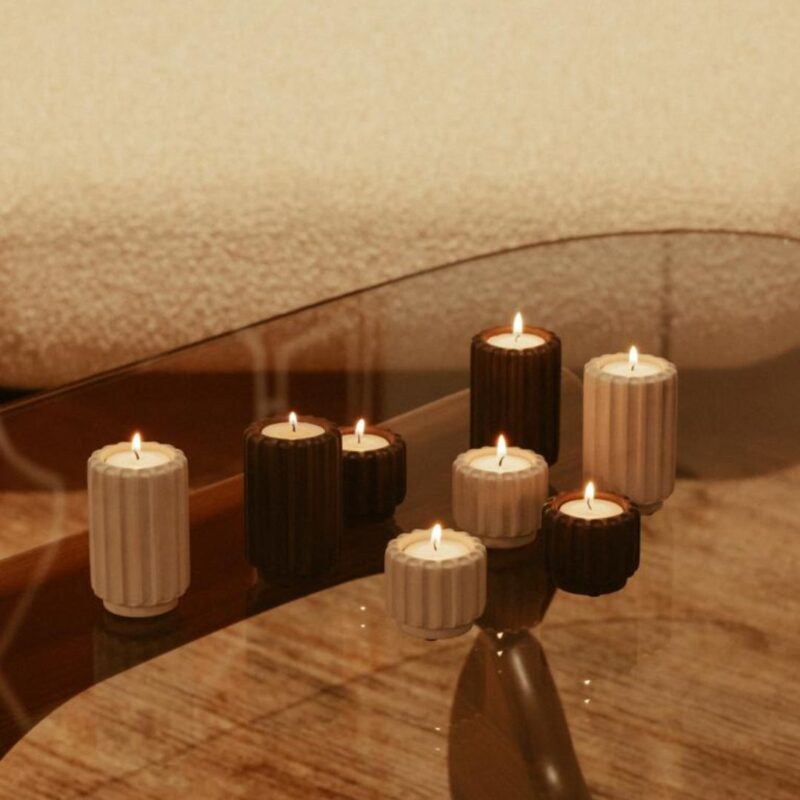 Dentelles wide t-light holder in wine colour with ribbed cement design, styled as an elegant interior candle accessory. Combines beautifully with other colours and sizes