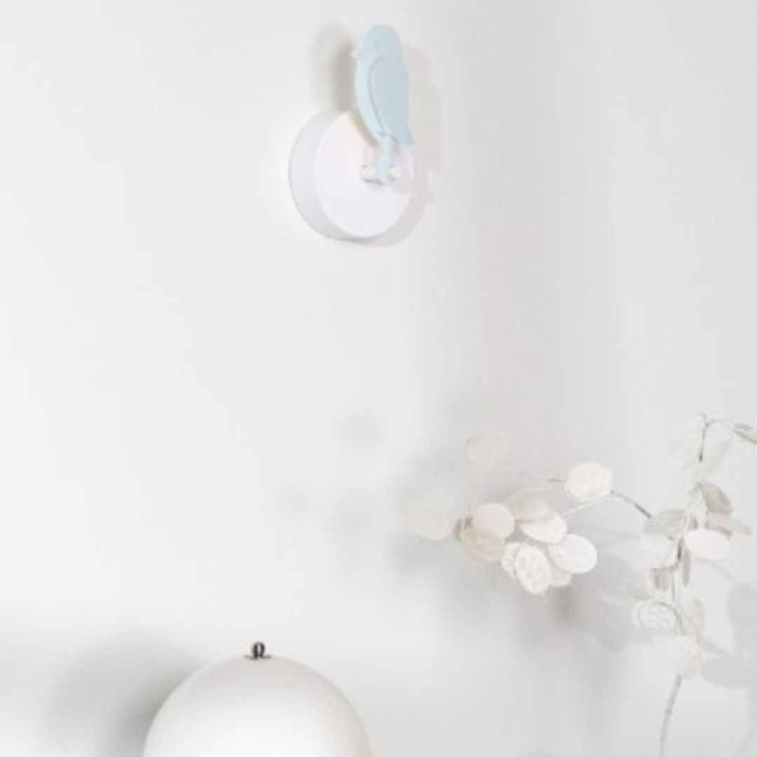 Birdie 2.0 air quality monitor for home in Glacier light blue mounted on wall