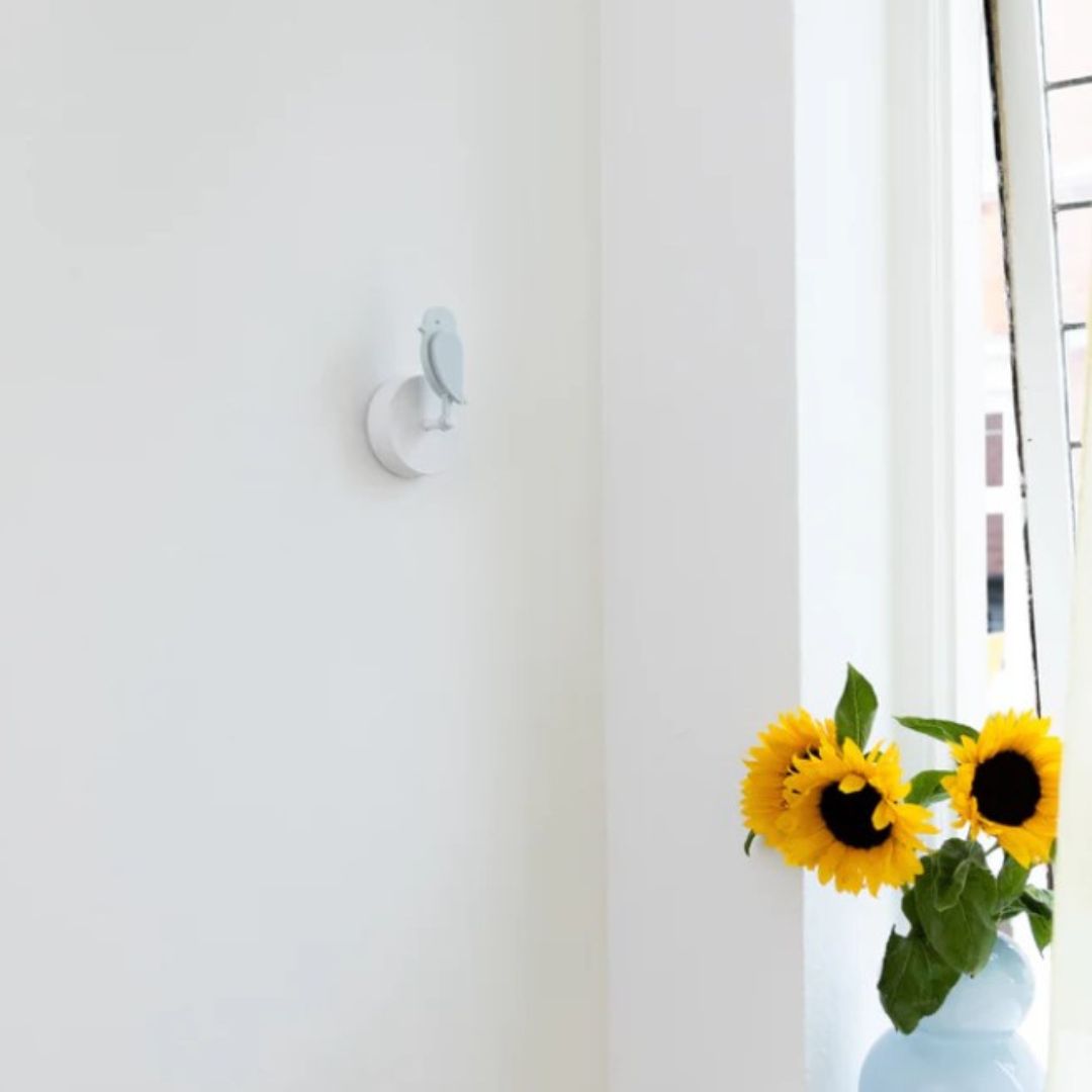 Birdie 2.0 air quality monitor for home in Glacier light blue mounted on wall