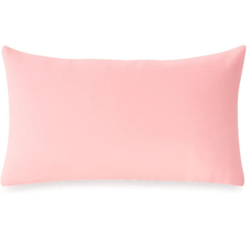 Emotional Support Pillow with embroidered hearts by The Pillow Drop on a sofa in a cosy living room