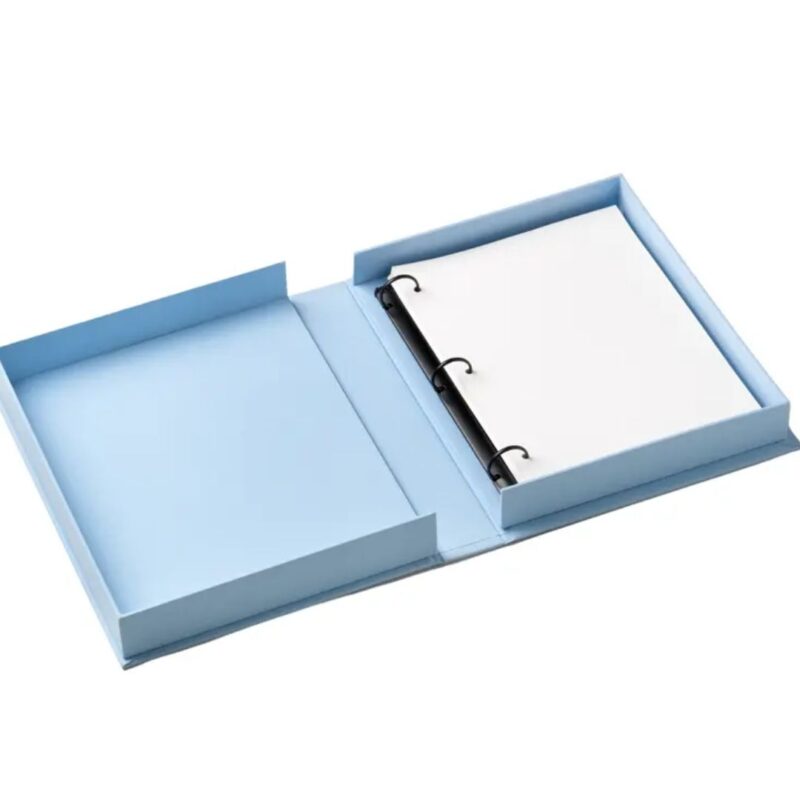 Printworks Dolce Vita embroidered photo album with blue cotton cover and colourful stitching displayed on a coffee table open with 30 pages