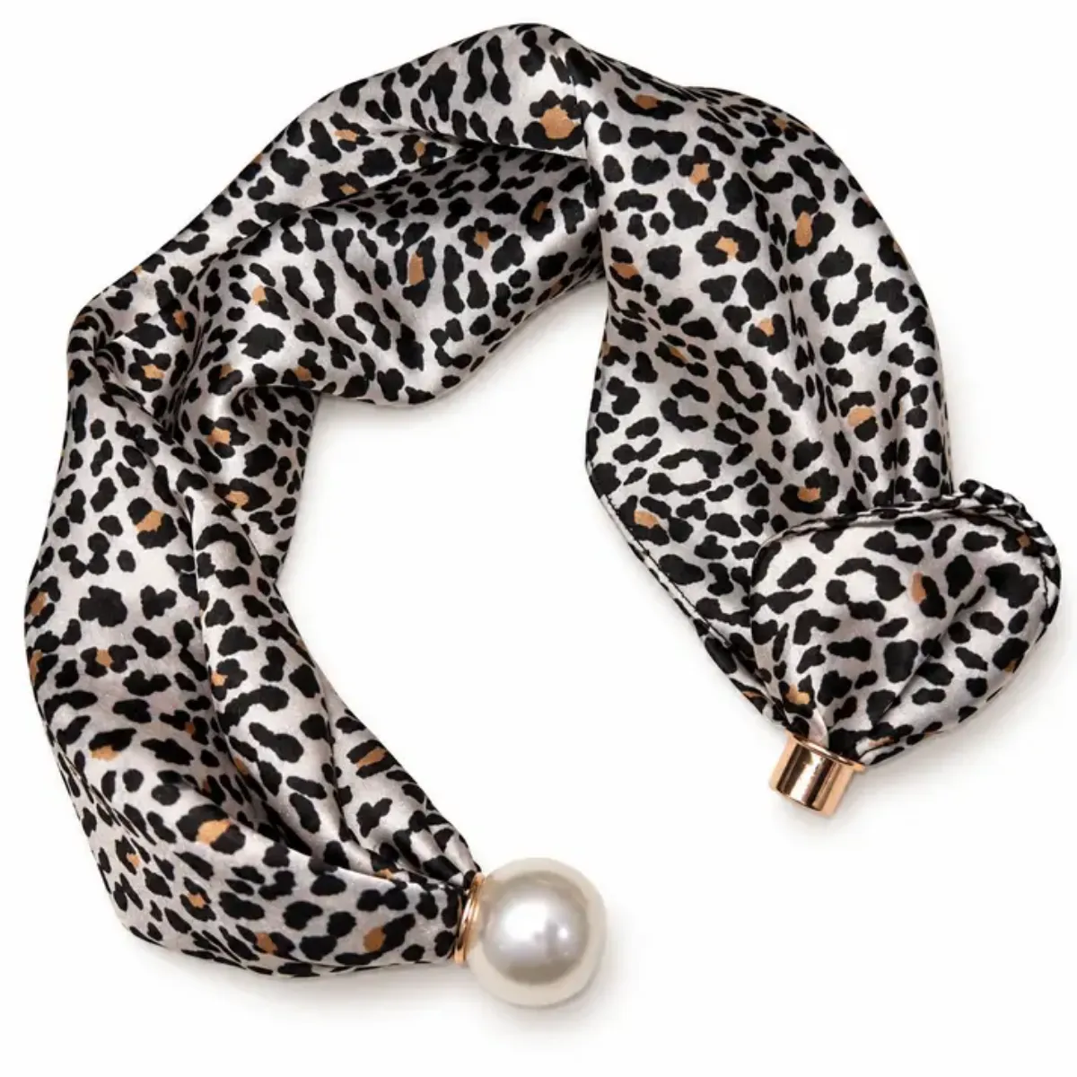 Close-up of magnetic pearl clasp on leopard print scarf