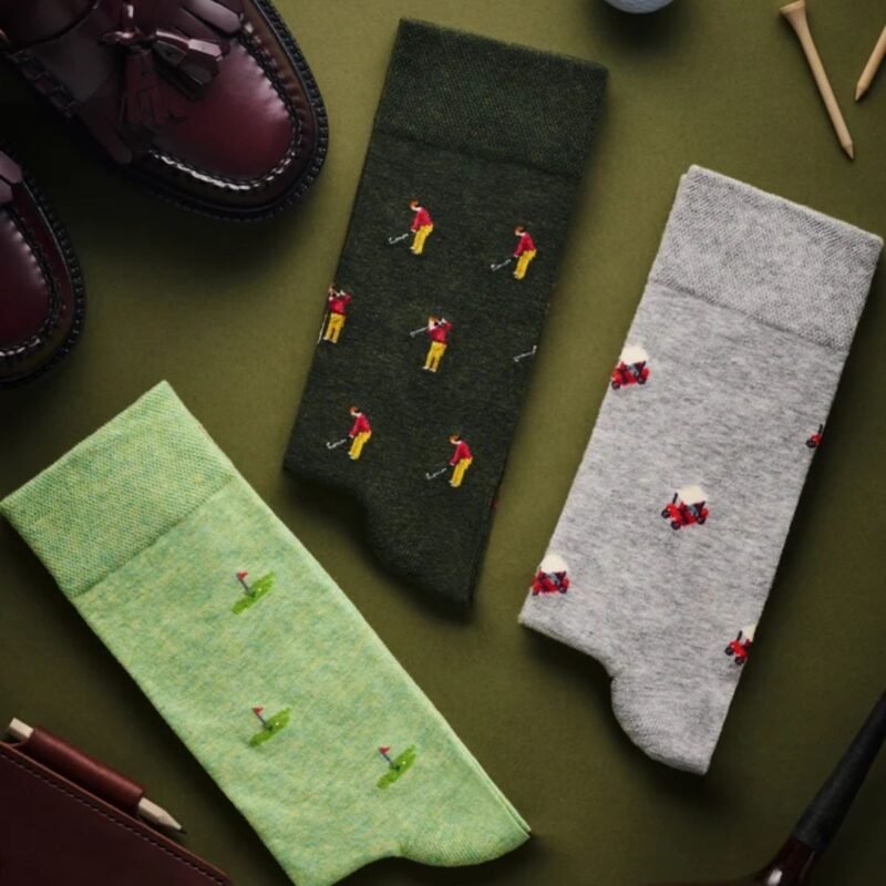 Three pairs of golf socks The Golfer The Pin and The Buggy