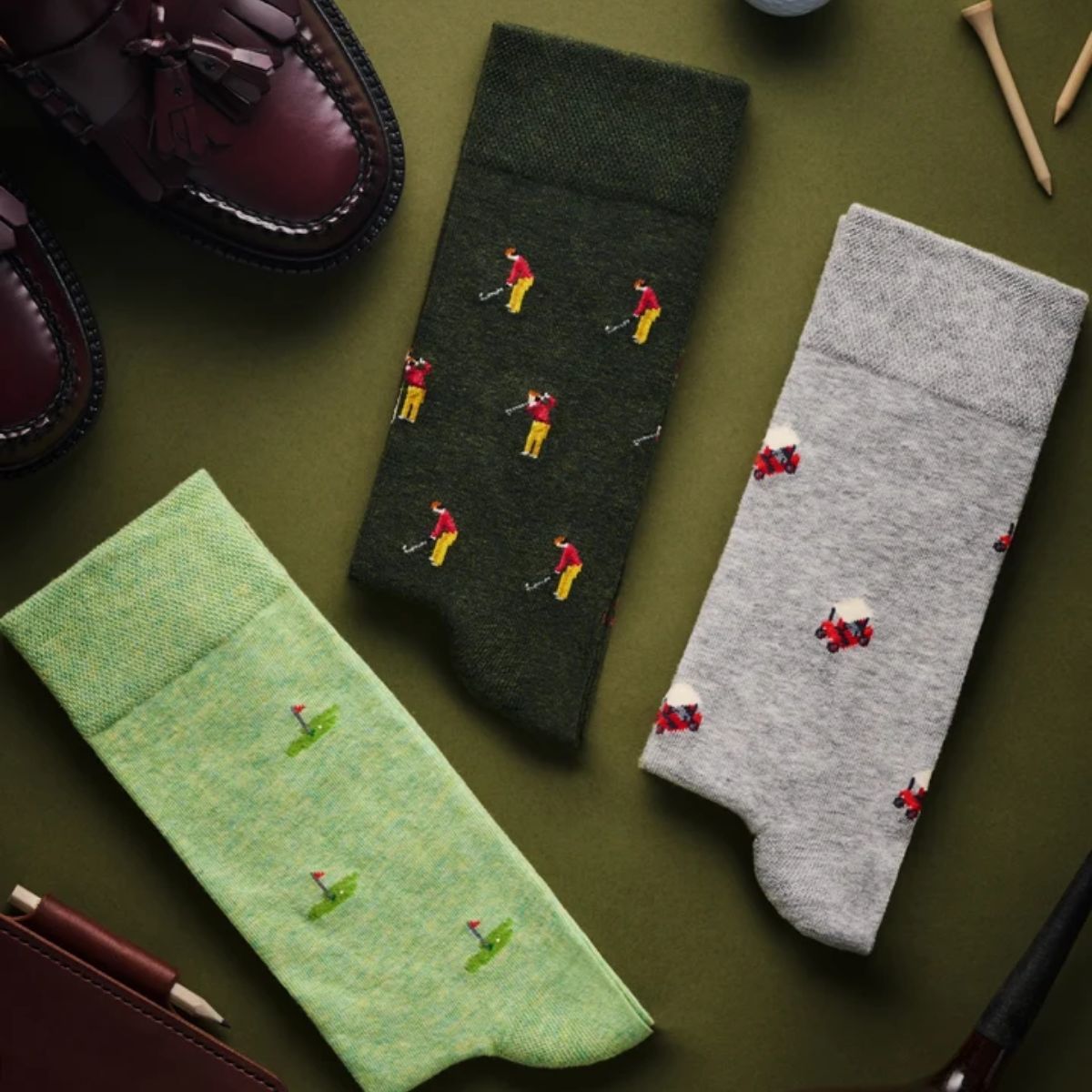 Three pairs of golf socks The Golfer The Pin and The Buggy